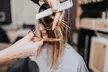 Get Women's Haircut, Single Process Color, Highlights w/ Glaze + Blowout at Leelas Hair Salon- Up to 48% Off - Second Medium
