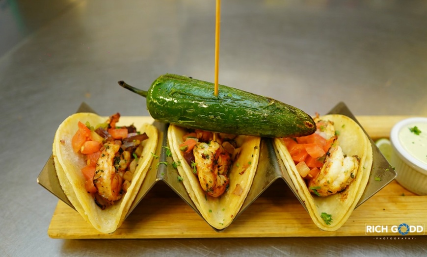 Image 4: Enjoy Savoring Mediterranean-Inspired Tapas with Refreshing Sangria!