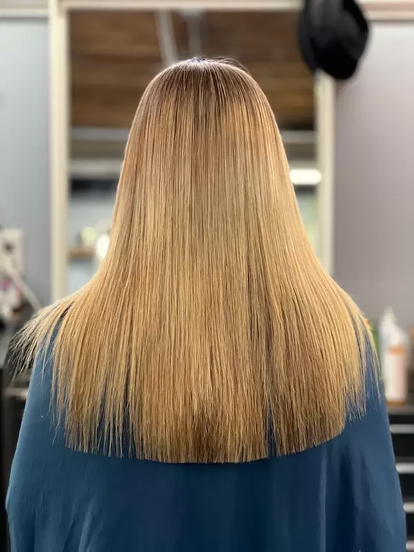 Experience Planet Color Salon's Brazilian Blowout and Haircut options with up to 45% off for silky, smooth hair