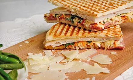 $12 for Two $10 Vouchers for International Café Cuisine at Guy & Gallard ($20 Value). 9 Locations Avaiable. - Primary Image