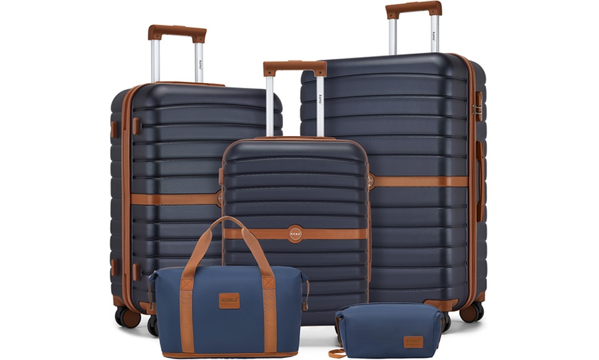 Image 1: Set de viaje azul marino con maleta rígida, bolsa de mano y neceser