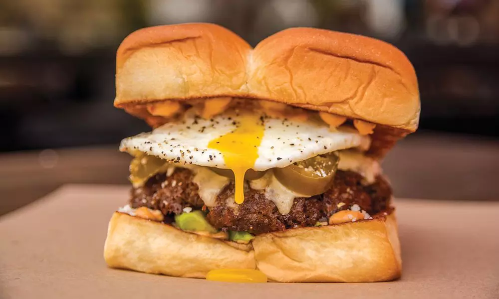 Sausages, Hot Dogs, and Burgers for Two or Four or More at Dog Haus (Up to 40% Off) - Primary Image