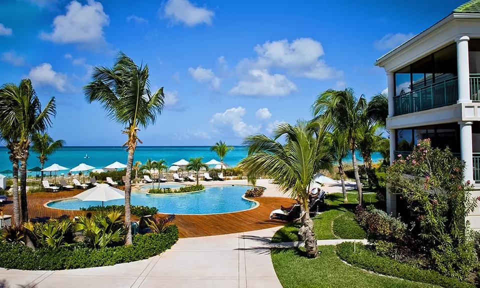 ✈ Stay at The Sands at Grace Bay with Airfare. Price per Person Based on Double Occupancy. Includes Taxes and Fees. - Primary Image