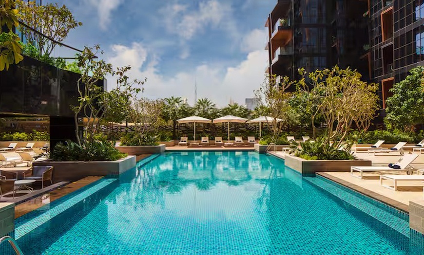 Image 1: Enjoy Pool Access with Food and Beverage Credit for 1, 2, or 4 Adults