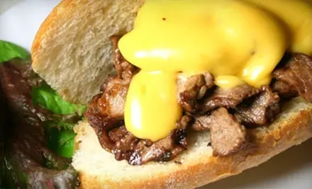 $7 for $14 Worth of Cheesesteaks, Steak Fries, and More at The Cheese Steak Shop - Primary Image