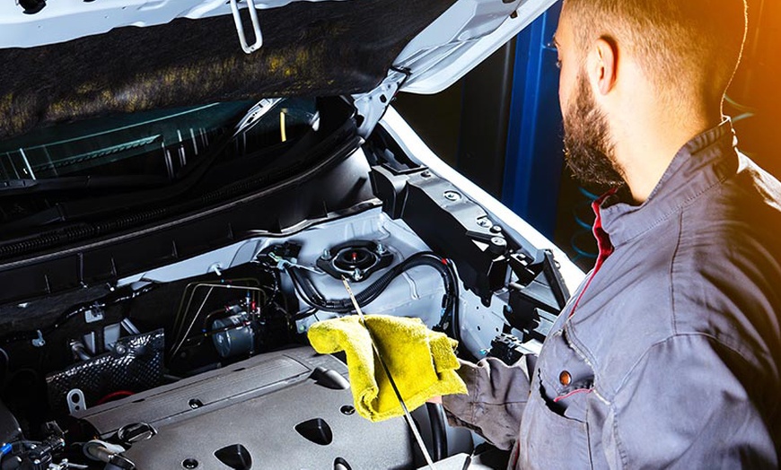 Image 2: Premium Blend or Full Oil Change Service with Free Car Wash