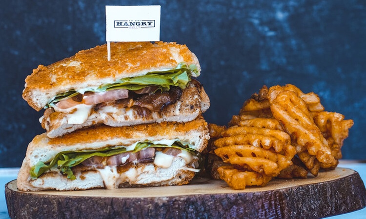 Bite Into Bliss: $25, $50, $75 or $100 Dining Credit at Hangry Belly