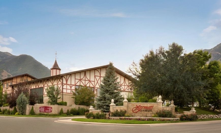 Image 3: Cozy alpine rooms, heated pool, and mountain views