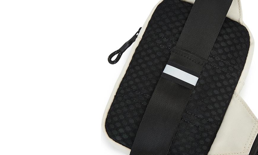 Image 10: Bolso bandolera unisex con correa ajustable y múltiples bolsillos
