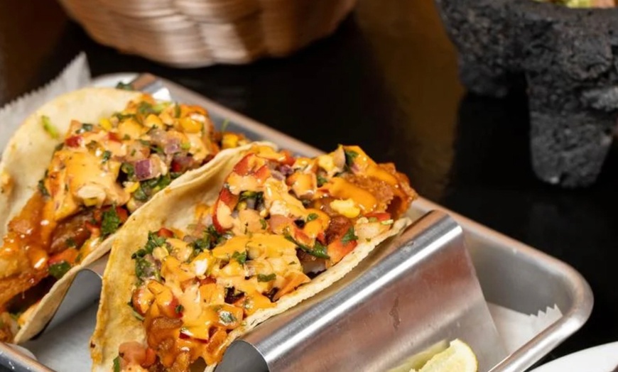 Image 11: Vibrant Rooftop Dining: Choose Meals, Margaritas, or Dining Credit