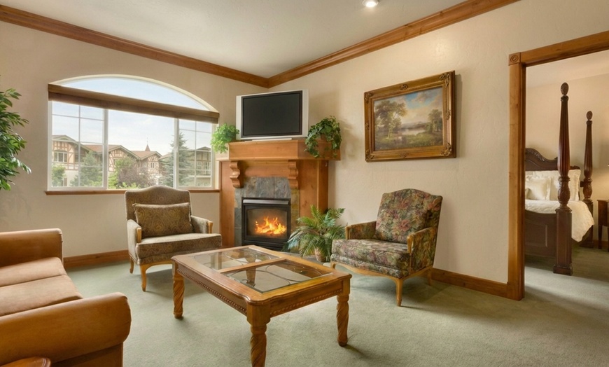 Image 5: Cozy alpine rooms, heated pool, and mountain views