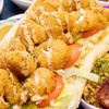 Image 12: Two Po'Boys, Meals for Two or Four With Beignets, and $50–$75 Credits