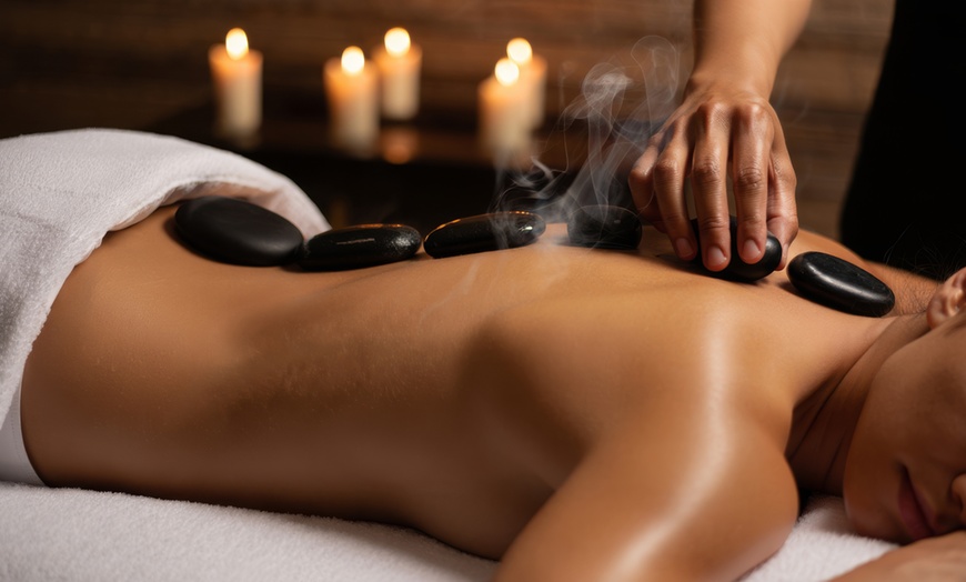Image 1: Up to 54% Off!! Customized Massage with Hot Stones or Cupping
