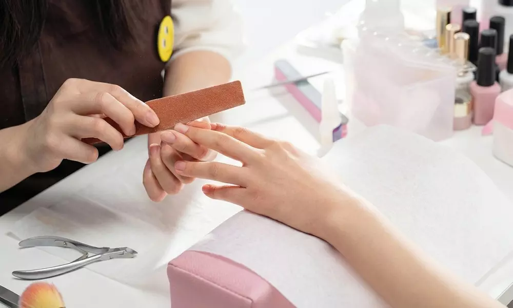 Powder Gel Manicure with Eyebrow Services at Deluxe I nails (18% Off)
