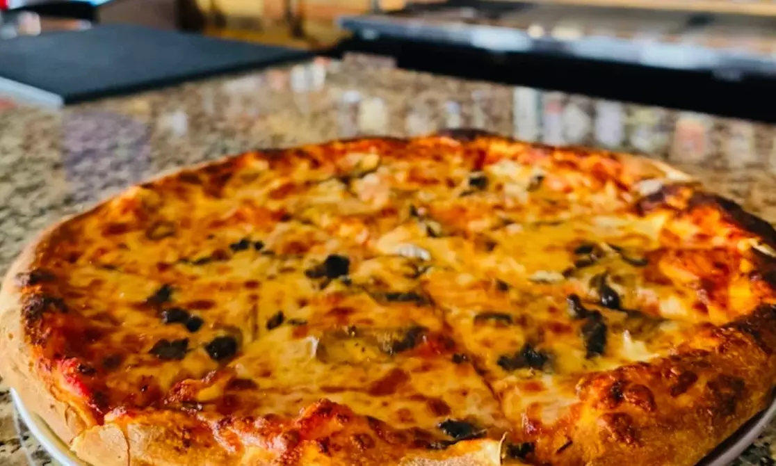 $50, $75, or $100 Dining Credit | Dozen Wings, Fries, Entrees, & More