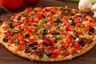 Large/Specialty Pizza, Wings, Beer/Wine, Drinks, $50 Credit, or More at Mountain Mike’s Pizza (Up to 22% Off) - Second Medium