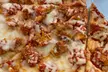 Slice into Savings: Pizza & Drink Duo, Up to 36% off Specialty Pies and a Salad for Two or Four People - Second Medium
