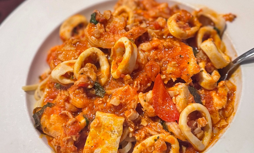 Image 2: Indulge in a Sumptuous Italian Meal and Refreshing Drinks!
