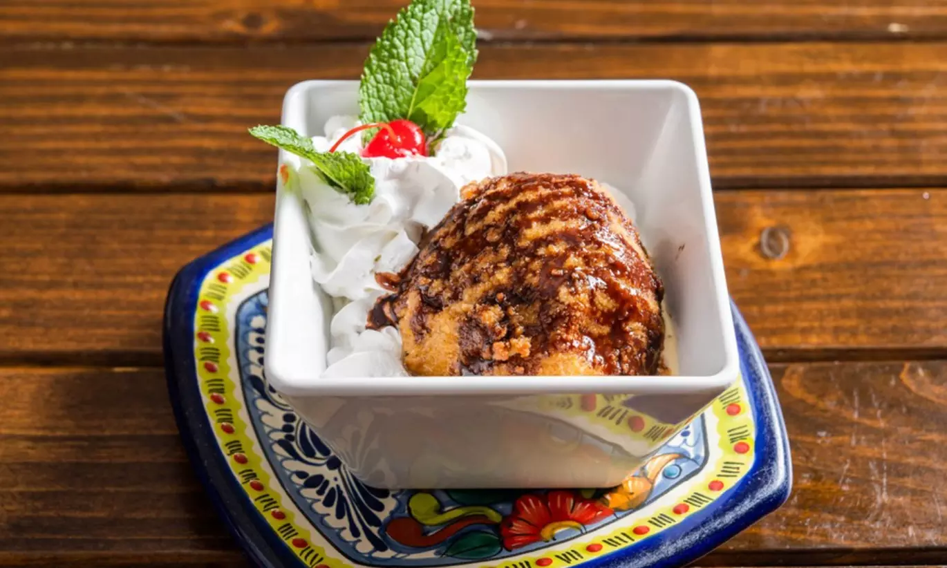 Vibrant Rooftop Dining: Choose Meals, Margaritas, or Dining Credit