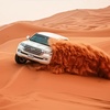 Image 1: Evening Desert Safari + BBQ, Sandboarding & Camel Ride For Up to 6