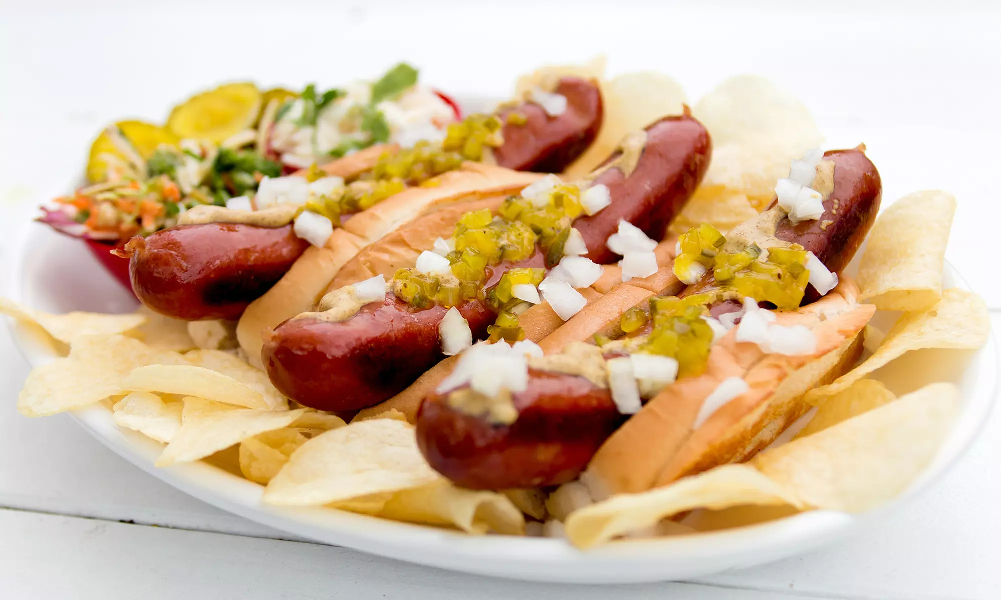 Indulge in The Savage Wiener's gourmet hot dogs with options like 2 Colossal Wieners and a Wiener Flight, all up to 25% off - Primary Image