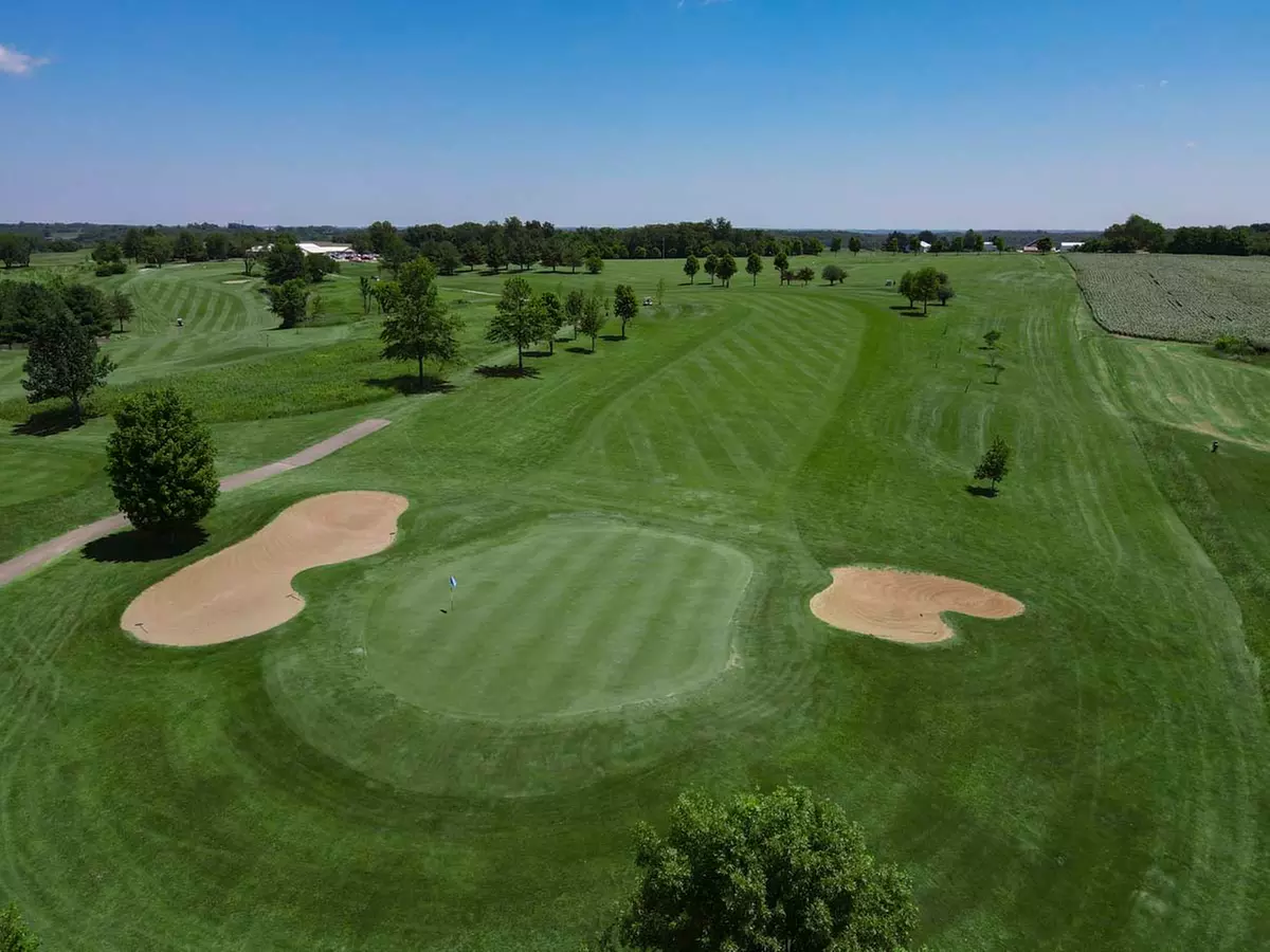 Experience 18 Holes Golf with Cart, Range Balls, and Scenic Elevation