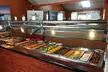 Discover the Flavors of Baingan with $15 off a $55 order or $30 off a $100 order and Experience Authentic Indian Cuisine - Second Medium
