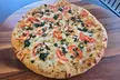 Crave-Worthy Combos - Choice of Appetizers, Large Salad, 14'' or 16'' Specialty Pizza, & More (Up To 36% Off) - Second Medium