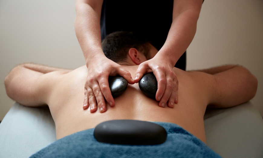 Image 1: 60-Min Full-Body Massage with Hot Stones for Deep Relaxation 