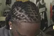 Up to 33% Off Revitalize Your Look with Loc Retwist or Silk Press Services - Zhanés Hair fortress - Second Medium