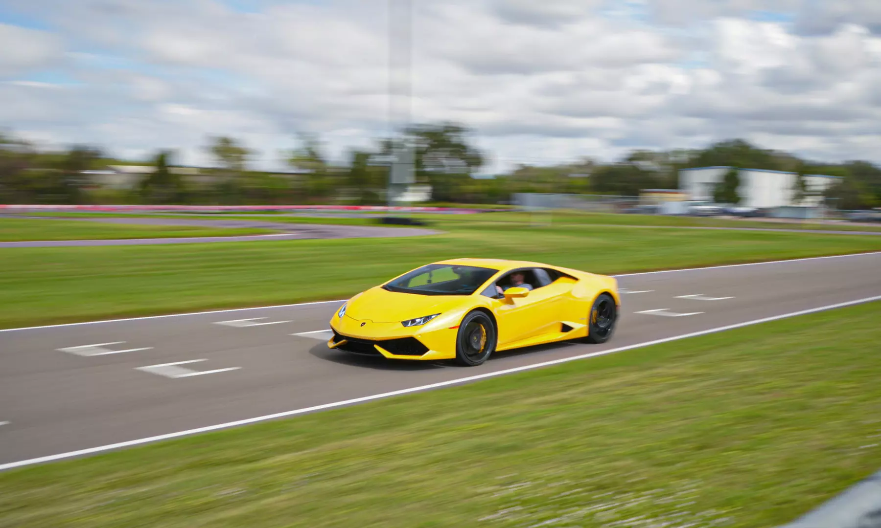 Enjoy a 3-Lap Premium Racetrack Driving or Ride Along for 1 or 2