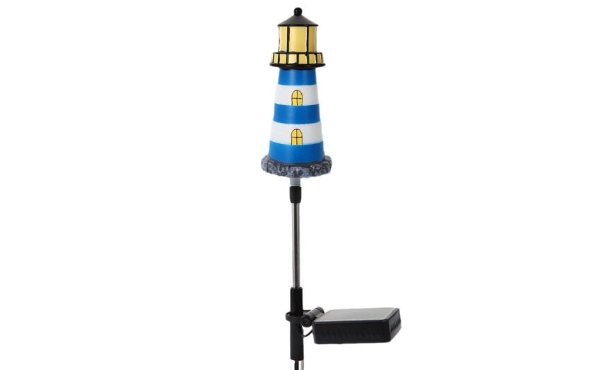 Image 6: One, Two or Four Solar Powered Lighthouse Shaped Garden Lights