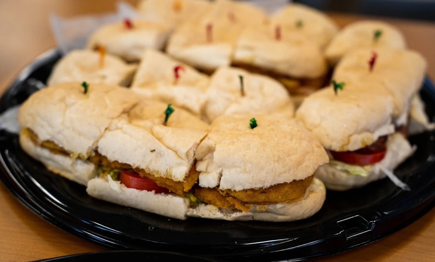 Image 15: Two Po'Boys, Meals for Two or Four With Beignets, and $50–$75 Credits