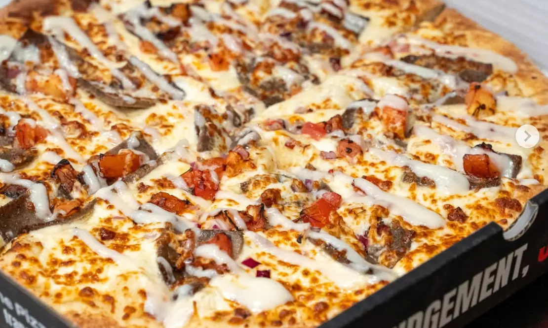 Credit to Spend on Food and Drinks or Large Signature/Classic Pizza