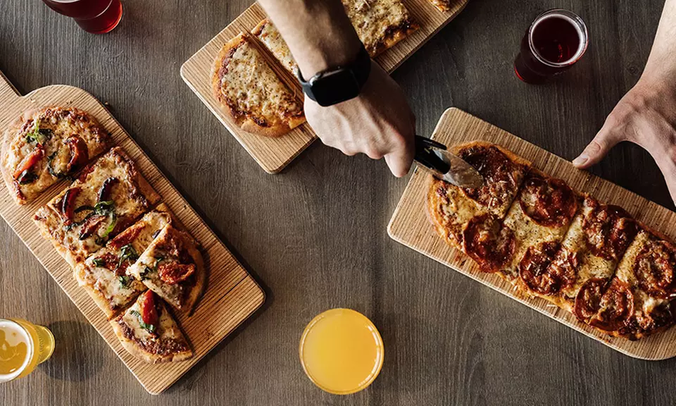 Indulge in Pizza and a Flight of Cider for One, Two, or Four People