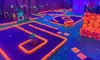 Experience Blacklight Minigolf Rounds and Arcade Games at Outrageous Mini Golf for Up to Four, Save Up to 27%