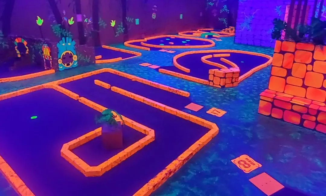 Light Up the Fun with Blacklight Minigolf Rounds and Arcade Games!