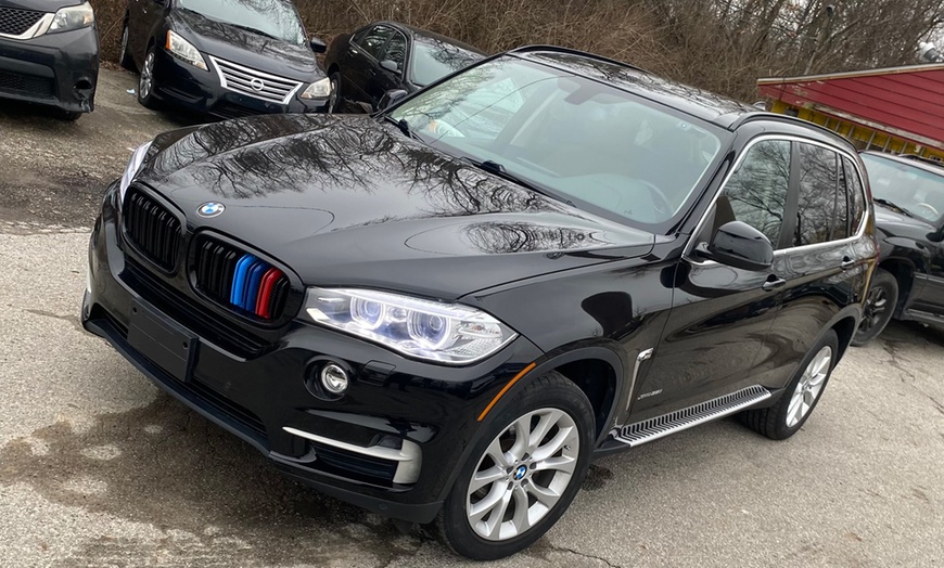 Image 2: Revitalize Your Ride with Quick Wash and Wax Options