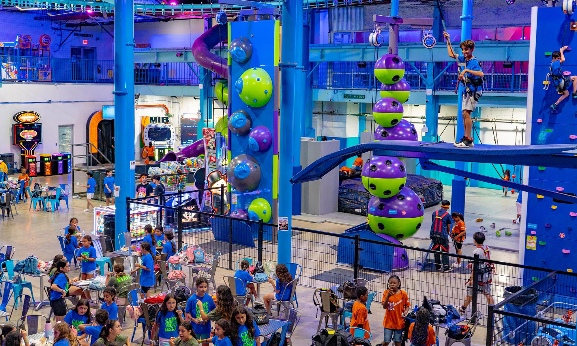 A zip line and rope course inside an adventure park