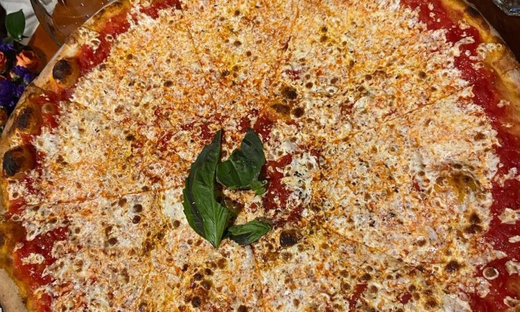 Enjoy a Pizza Making Class for Two or Four with Drinks