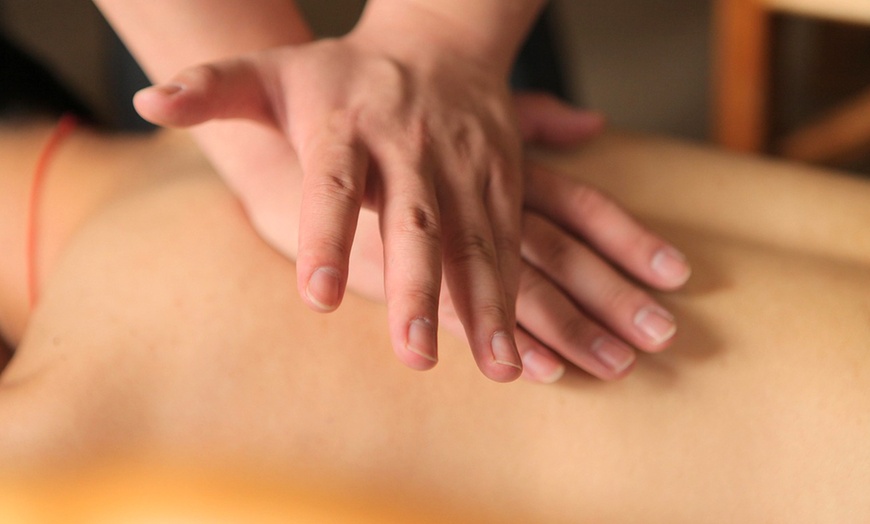 Image 3: 60 or 90 Min Deep Tissue Oil & Hot Stone Massage for One
