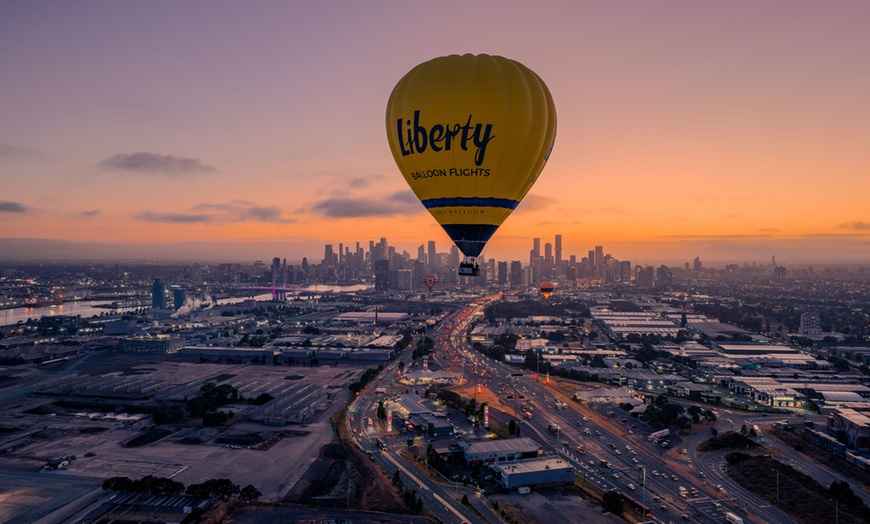 Image 1: Fly Over Yarra River & Melbourne's Iconic Landmarks During Sunrise