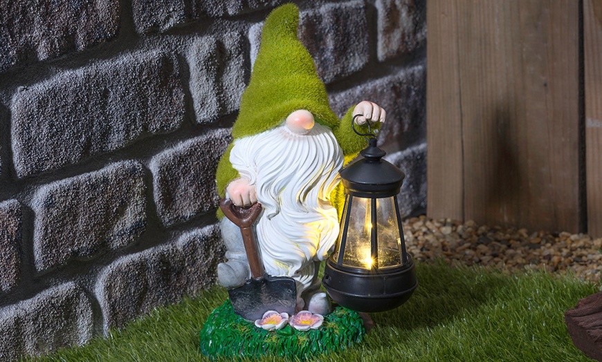 Up To 45% Off One or Two Solar Lantern Flocked Garden Gnomes | Groupon