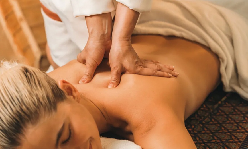 Image 1: Couples 50-Minute Signature Bodywork with Hot Stones and Essential Oil