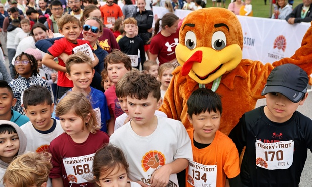Runners participating in a Turkey Trot race on Thanksgiving morning.