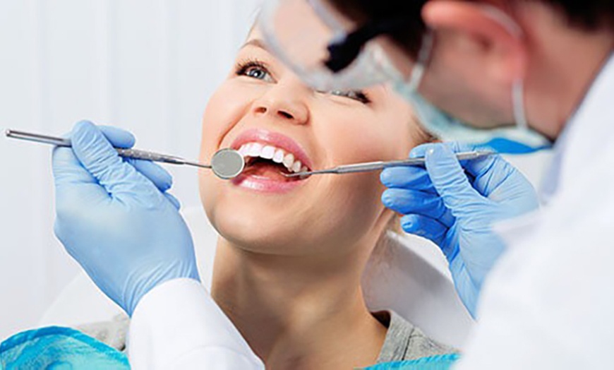 Image 10: Dental Check-Up & X-Rays w/ Optional Clean & Fluoride Treatment & More