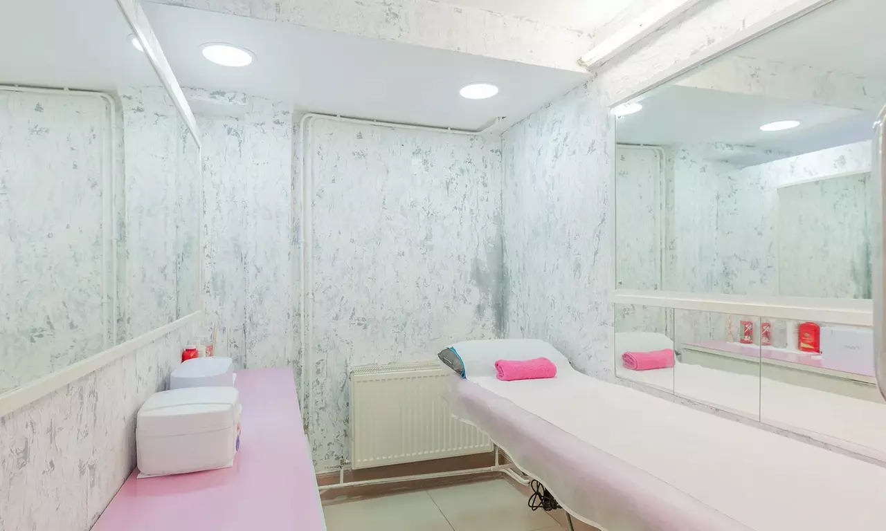 Facial and Head Massage with Optional Manicure or Mani-Pedi at Nail Candy - Primary Image