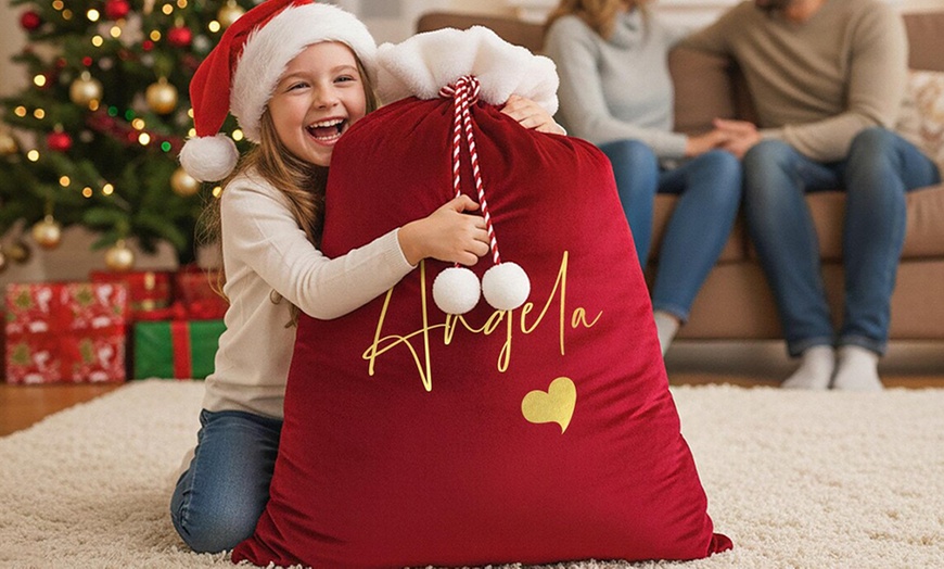 Image 8: Surprise loved ones with a festive, Personalized Santa Delivery Bag