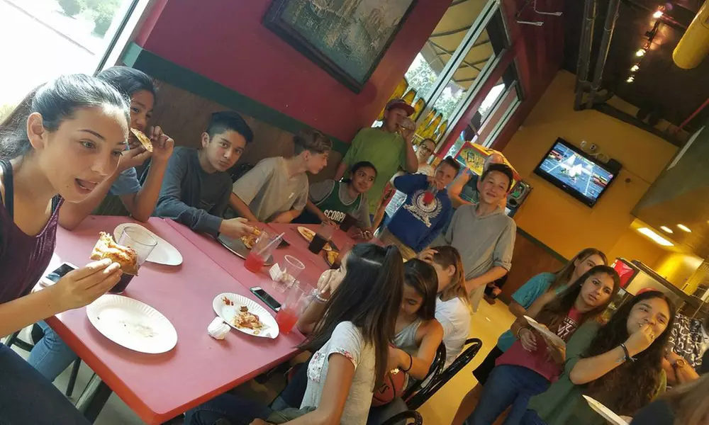 One or Two Large Pizzas with Two Toppings, 2 Liter of Soda and More