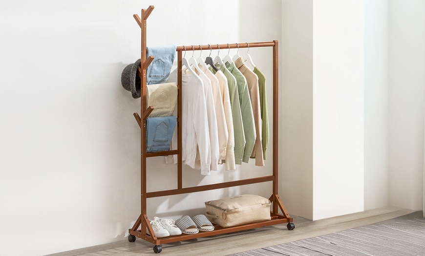 Image 3: Brown Bamboo Garment Rack with Wheels and  Bottom Shelf